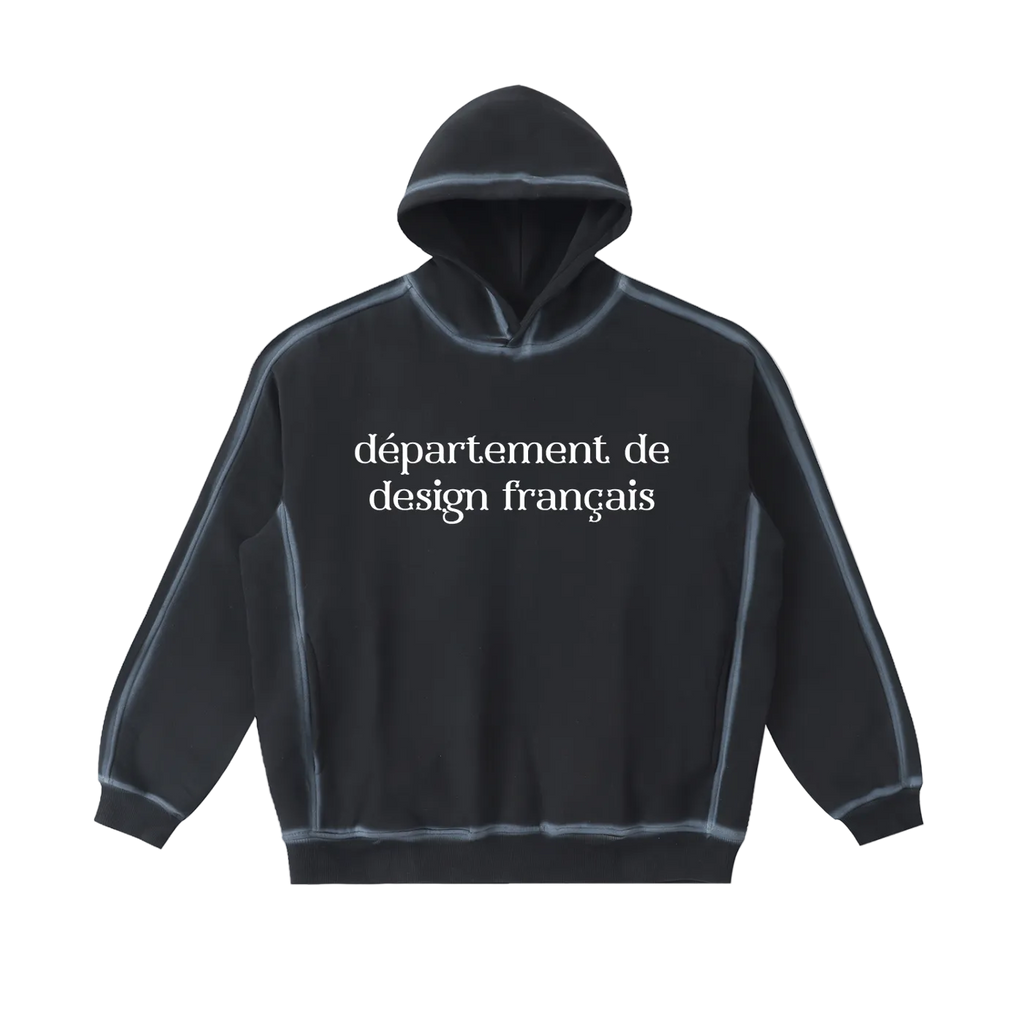 Sudadera oversized negra lavada getabbe con capucha, texto "département de design français" en blanco al frente, costuras visibles con efecto sun fade, corte holgado, fondo blanco