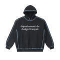 Sudadera oversized negra lavada getabbe con capucha, texto "département de design français" en blanco al frente, costuras visibles con efecto sun fade, corte holgado, fondo blanco