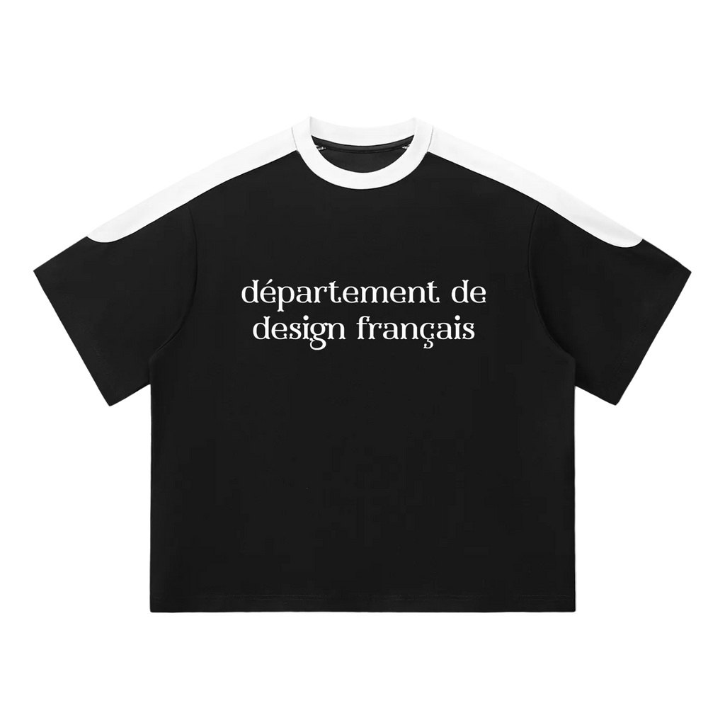 Camiseta oversized negra getabbe con texto "département de design français" en blanco al centro, panel blanco en hombros y cuello redondo en contraste, manga raglán color block, corte holgado unisex, fondo blanco