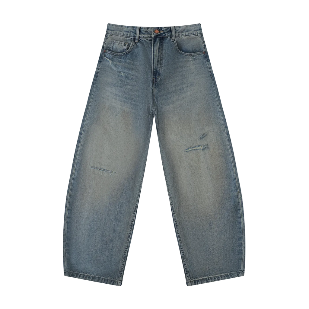 Jeans azules pierna ancha balloon getabbe con lavado vintage sun fade, roturas ripped en muslo y rodilla izquierda, desgaste en cadera, talle medio, bolsillos frontales, corte holgado hombre, fondo blanco